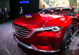 Mazda Koeru – единственный прототип из Топ-10 LiveCars.Ru, дизайн которого уже нашел отражение в серийной модели. Речь идет о <A href='http://www.livecars.ru/photo/2015/11/20/mazda_cx-9/' class=link target='_blank'>семиместном кроссовере CX-9</A>, дебютировавшем в Лос-Анджелесе месяц назад. Да, близнецами автомобили назвать нельзя, но даже небольшое сходство с Koeru позволило вседорожному флагману Mazda собрать массу восторженных отзывов.