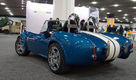Shelby Cobra 56 состоит из деталей, полученных при помощи новой технологии, на 75%. Весит родстер всего 635 килограммов. Реплику можно использовать по назначению – то есть для езды – благодаря современной гибридной силовой установке, которая состоит из ДВС, аккумуляторов и блока водородных топливных ячеек. Помимо этого, модель оснащена системой беспроводной подзарядки и продвинутой электроникой.
